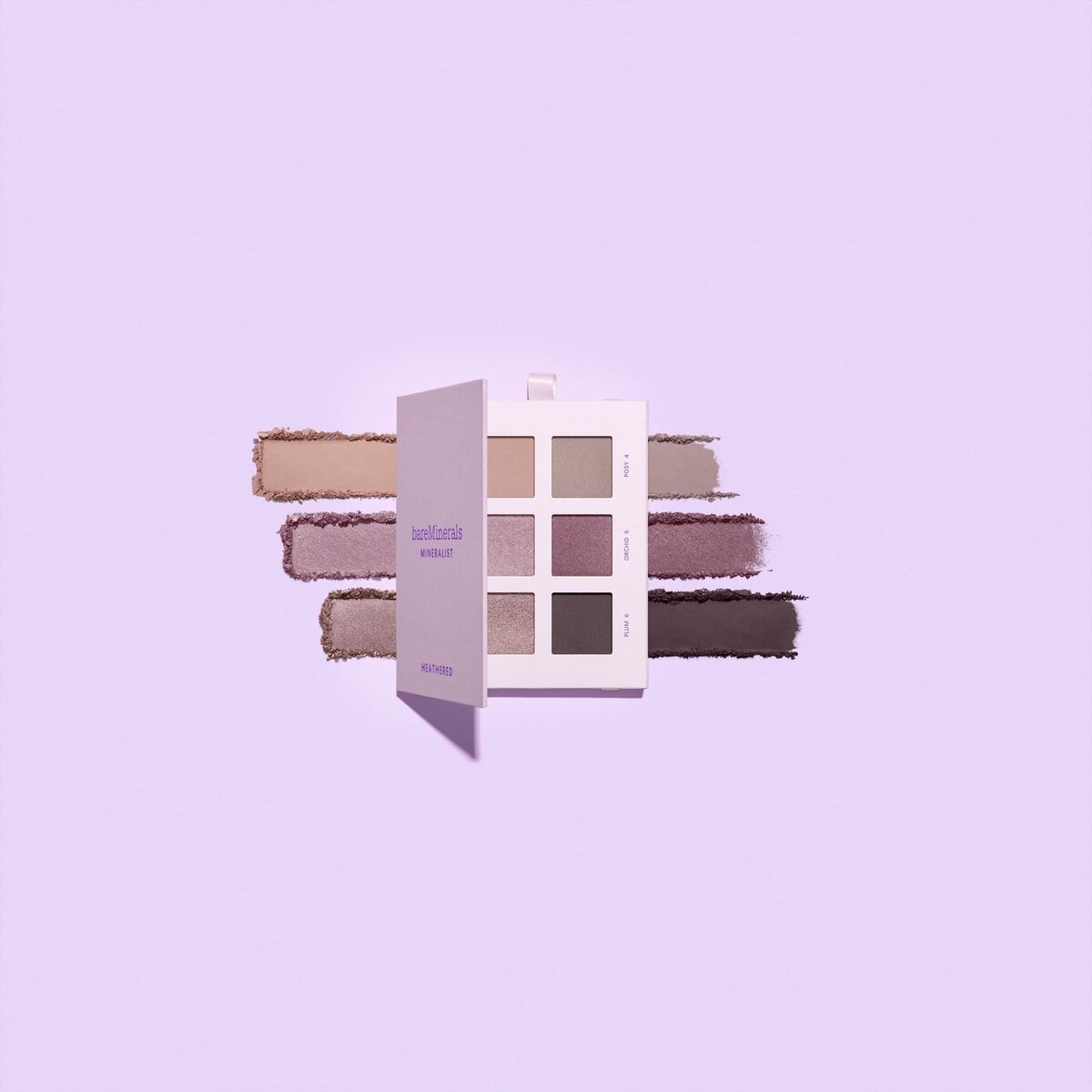 Correcteur facial Shine Inline Mineralist 7,8 g avec palettes de couleurs neutres sur fond pastel.