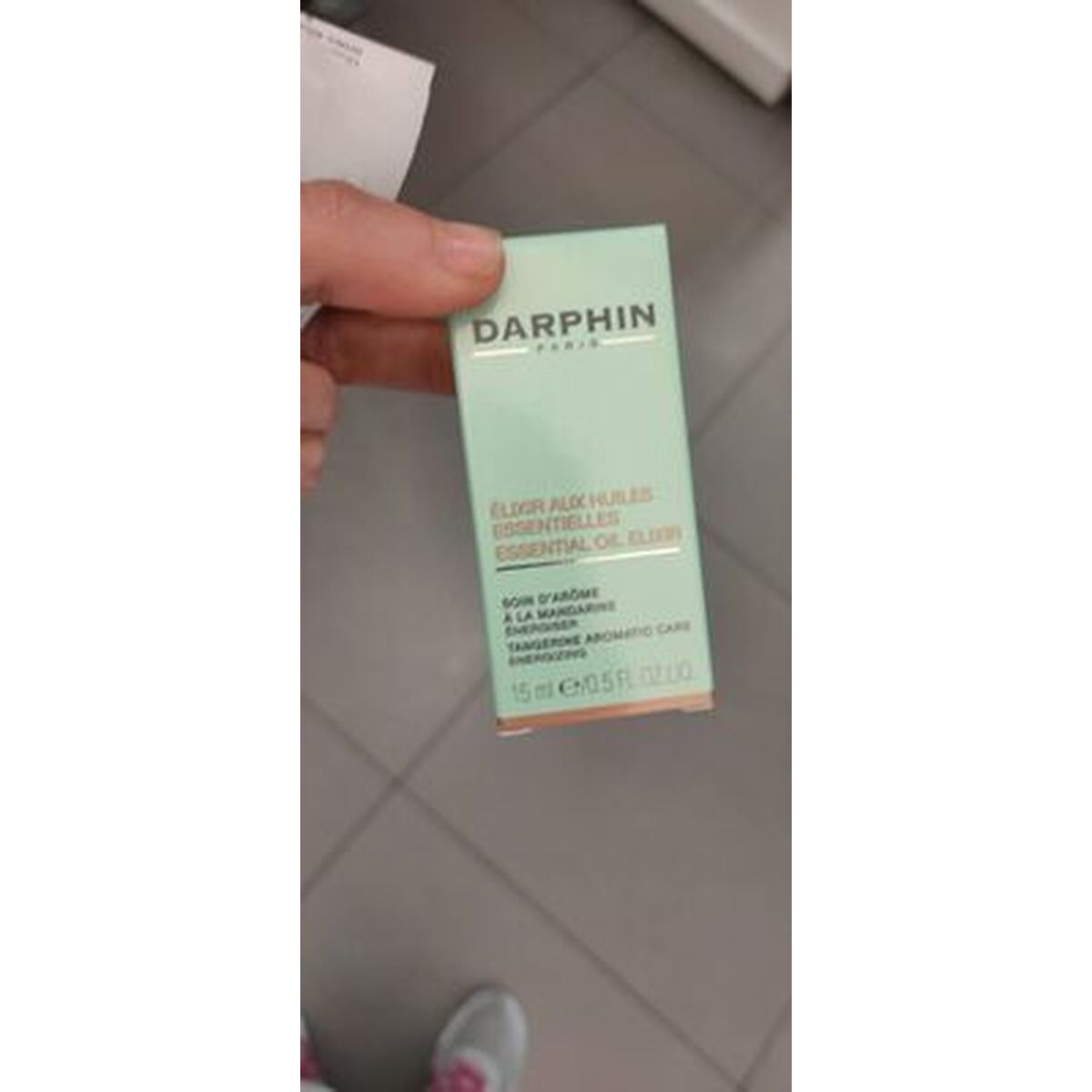 Packaging of Darphin Essential Oil Elixir for a radiant skincare routine, designed for all skin types.