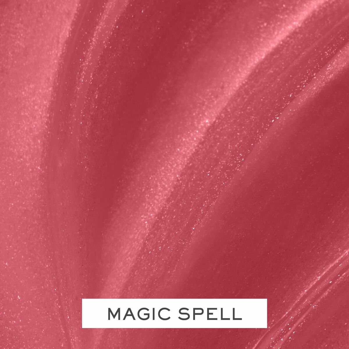 Close-up of Lancôme Juicy Tubes lipstick shade 'Magic Spell' showcasing its smooth texture and shimmer.