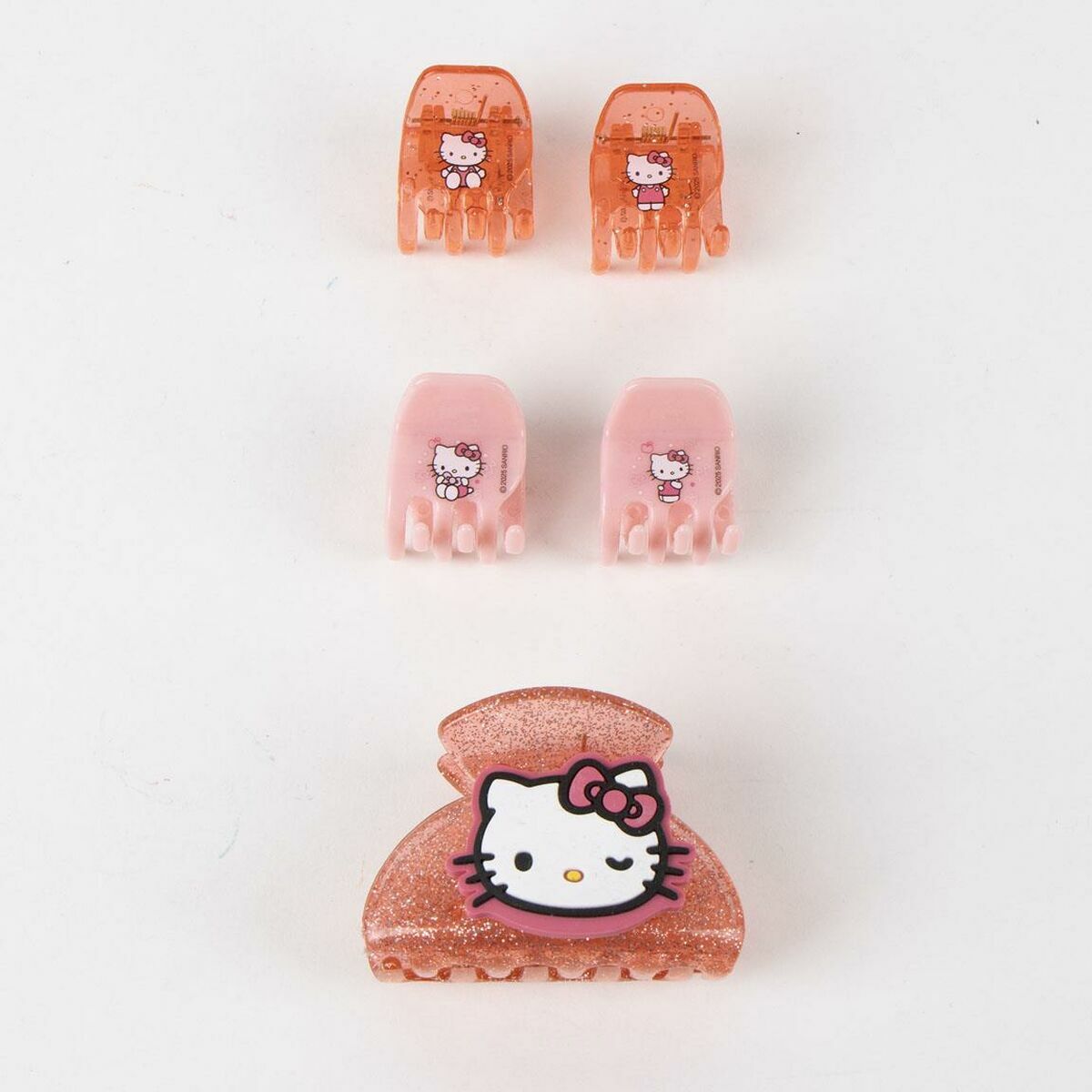 Set of Hello Kitty hair clips in pink and orange, perfect for enhancing your hairstyle with a cute touch.