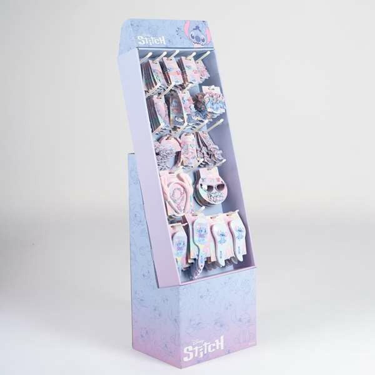 Affichage de pinces à cheveux Stitch Bleu sur un présentoir coloré et tendance.